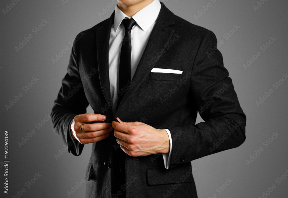Businessman in a black suit, white shirt and tie. Studio shooting Stock  Photo | Adobe Stock