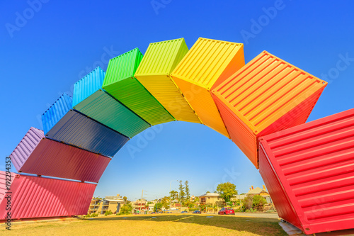 Fremantle travel welcome. Rainbow sea container in Fremantle Port near Perth, Western Australia. Homosexuality and universal symbol of hope concept. Sunny day with blue sky. Copy space. photo