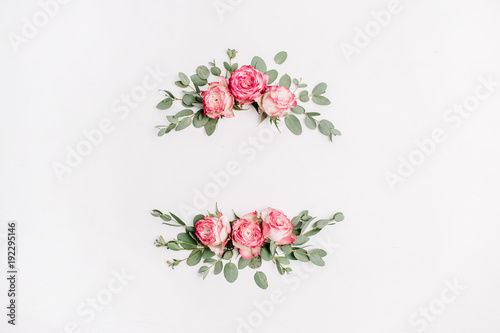 Floral frame wreath of white pink flower buds and eucalyptus on white background. Flat lay, top view mockup.
