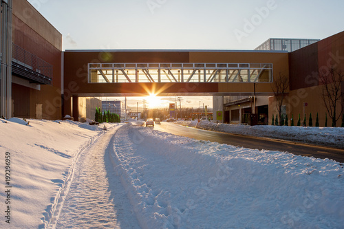 Winter road in snowy city landscape in sunset time in Sapporo, Hokkaido province, Japan for background.