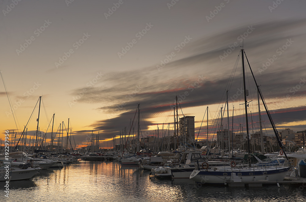 Port of Alicante in the Valencian community during a sunset.