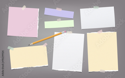 Quadro su tela Torn colorful and white note, notebook paper strips, sheets, pencil for text stuck with adhesive tape on dark gray background