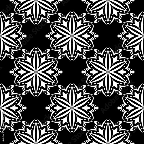 White floral seamless pattern on black background © Liudmyla