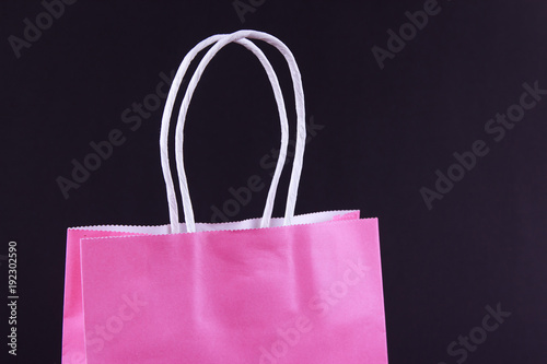 Pink shopping bag on black