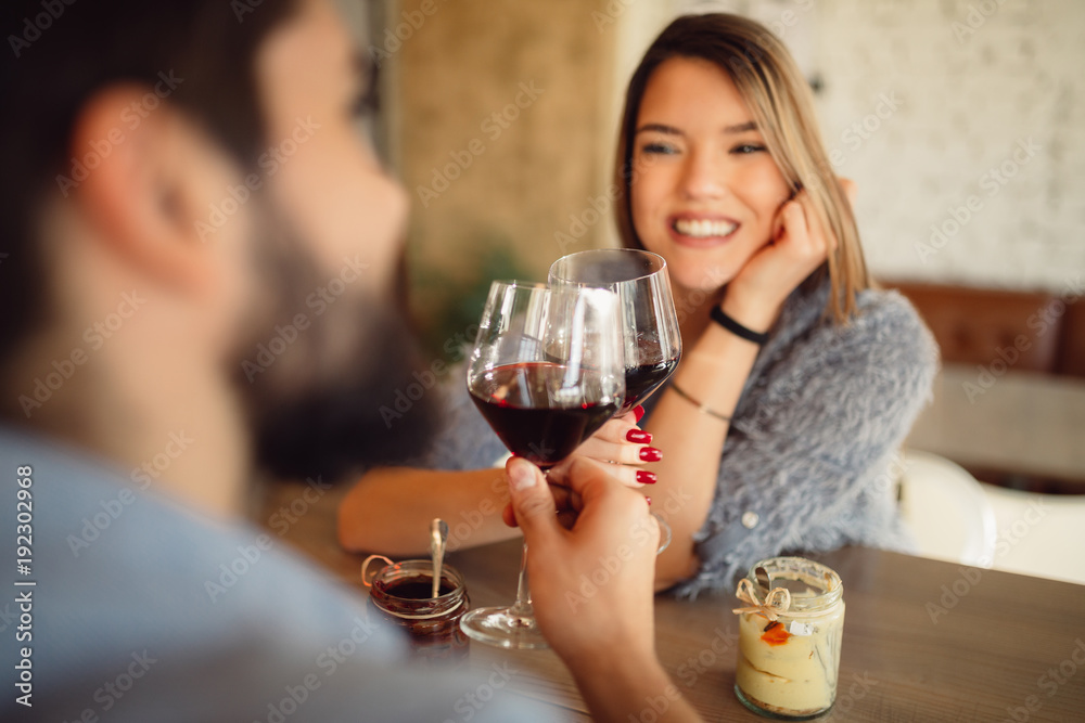 Couple clinking glasses with red wine. Couple celebrating anniversary, Valentine's day. Couple clinking glasses with red wine. Couple celebrating anniversary, Valentine's day.