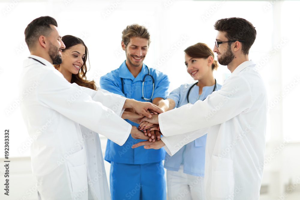 Doctors and nurses stacking hands. concept of mutual aid. Doctors and nurses stacking hands. concept of mutual aid.