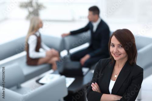 successful young business woman on blurred background office