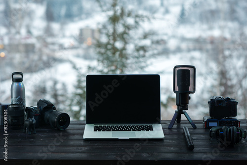 Audio / Video editing workspace office with mountain view. Photography and videography equipment. photo