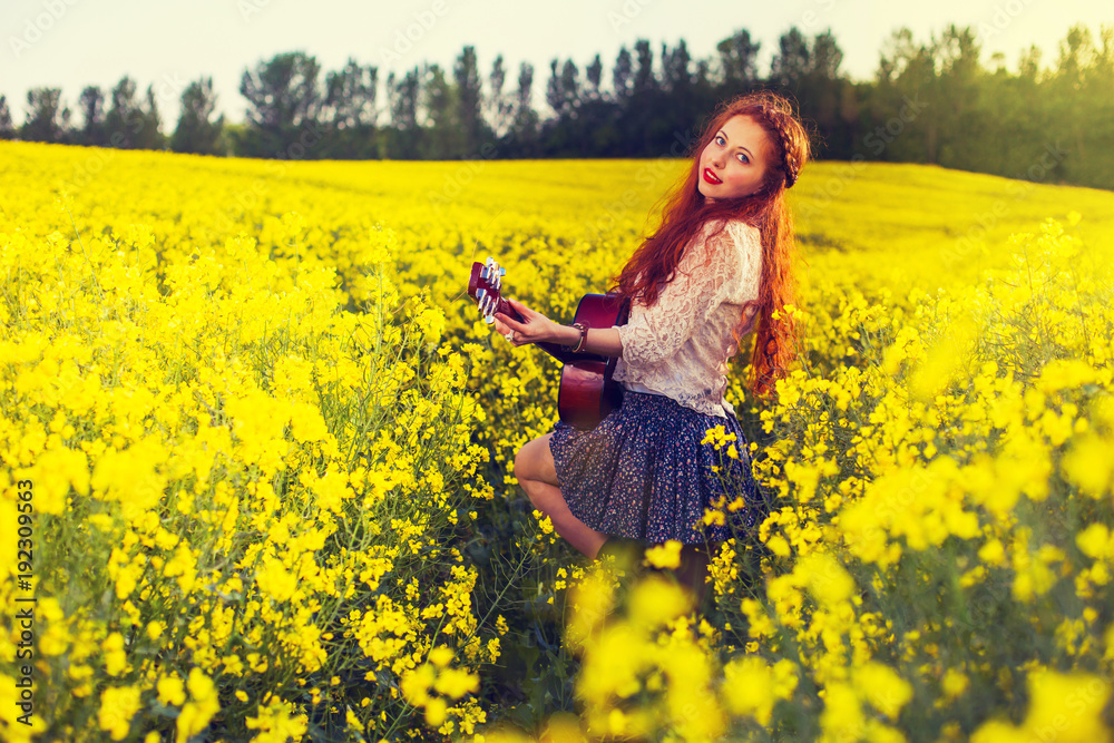 Fototapeta premium Young ginger hair girl in 70s style with acoustic guitar