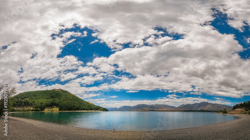 Admire the beautiful Panorama of Lake Tekapo and the Southern Alps in New Zealand.