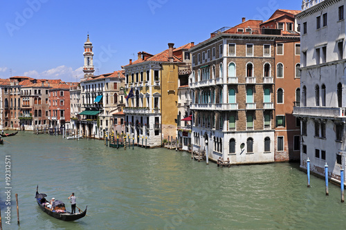 Venice historic city center, Veneto rigion, Italy - view on the Palazzo residences with vaporetto water taxis and gondolas on the Grand Canal