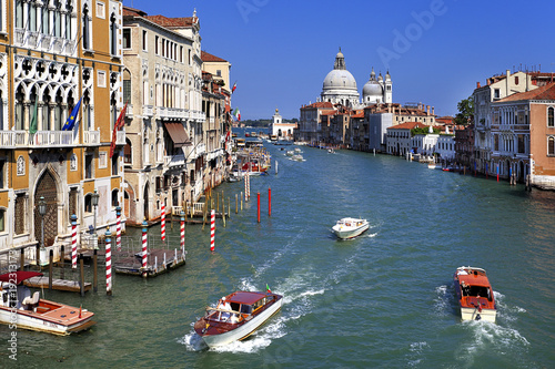 Venice historic city center, Veneto rigion, Italy - view on the Palazzo Cavalli-Franchetti residence and gondolas by the Grand Canal