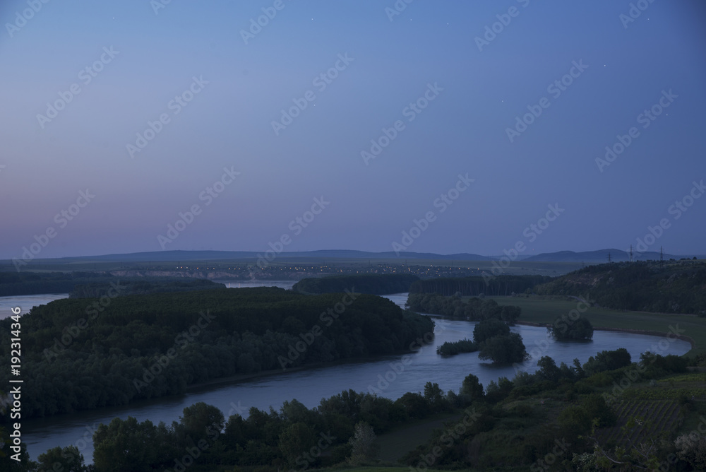 Blue hour over forest surrounded by rivers