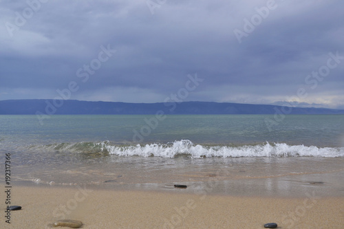 Baikal Wave crystal clear water before the storm on the background of a stormy sky infinite number of shades of blue Olkhon Island, the city of Irkutsk, Khuzhir