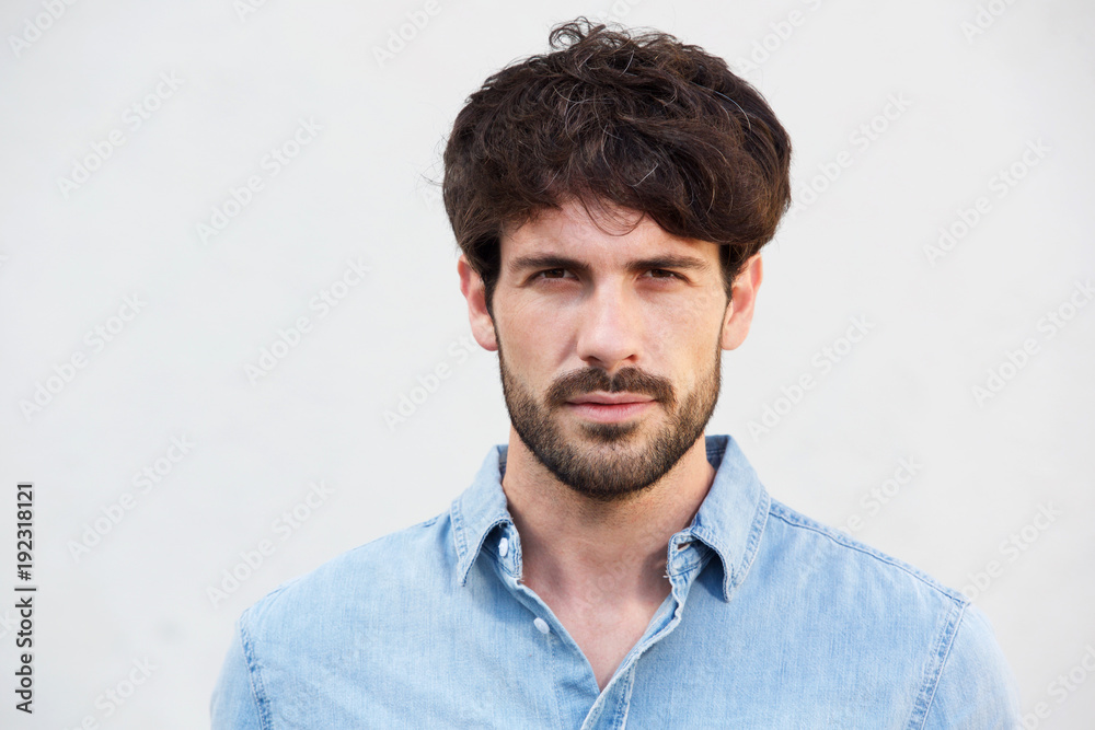 Obraz premium handsome young man with beard against white background