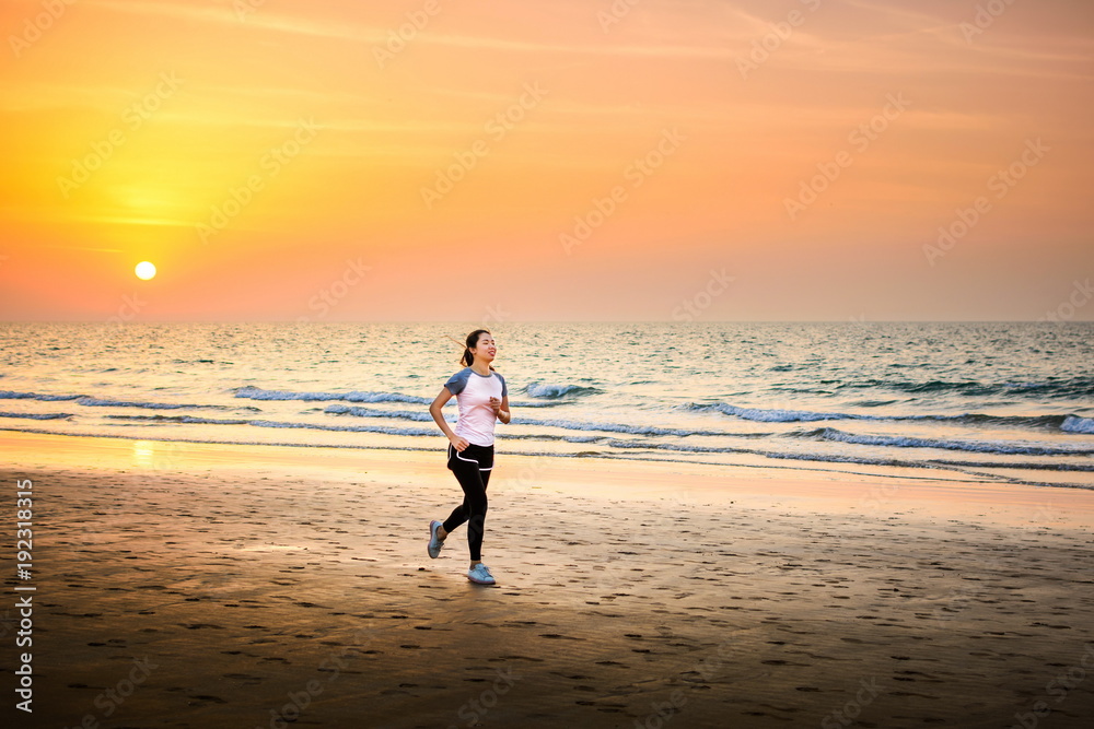 Girl running on the beach at sunset Girl running on the beach at sunset