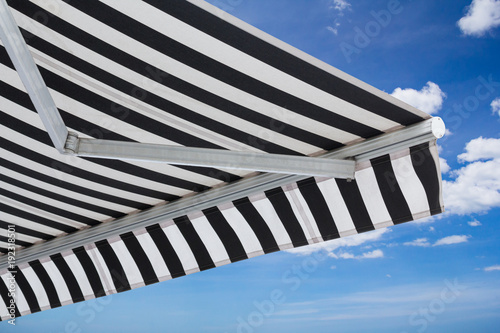 black and white striped awning isolate on white background photo