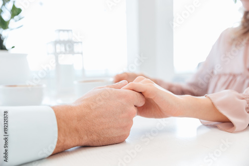 Cropped view of sensual lovely couple holding hand each other