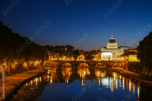 Night view of St. Peter's Basilica. Ponte Sant Angelo and Tiber River in Rome - Italy. Dramatic sunset with sbeautiful water reflection. Italy postcard © Kirill Gorlov