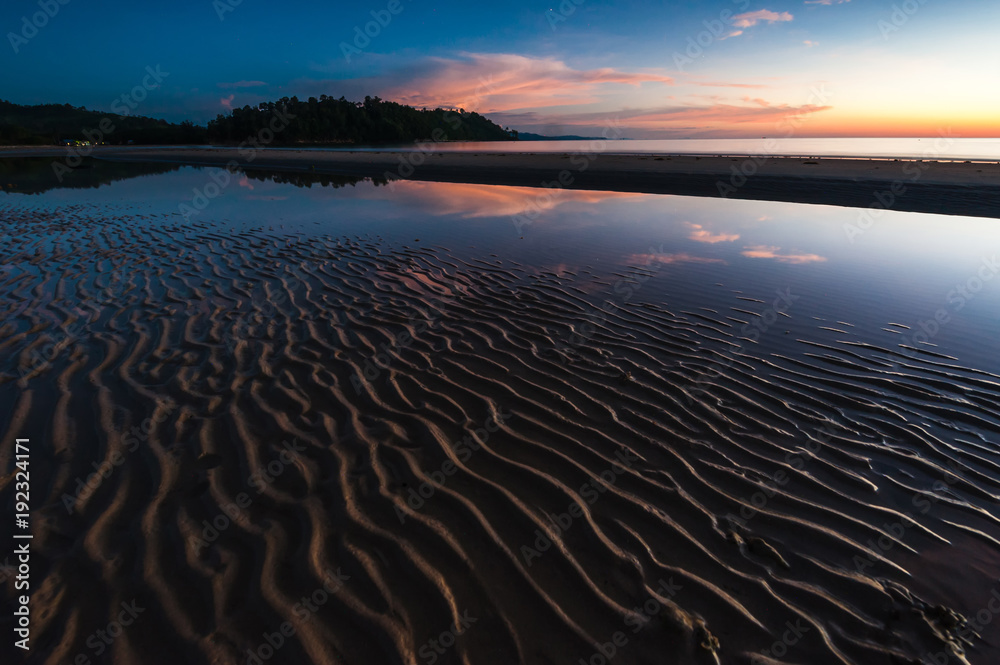 Sunset seascape at Indarason Beach, Sabah Malaysia. Blue hour scene with reflection.