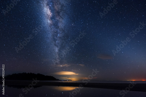 starry night sky with Milky way. image contain soft focus, blur and noise as night photo required high iso and long expose. © udoikel09
