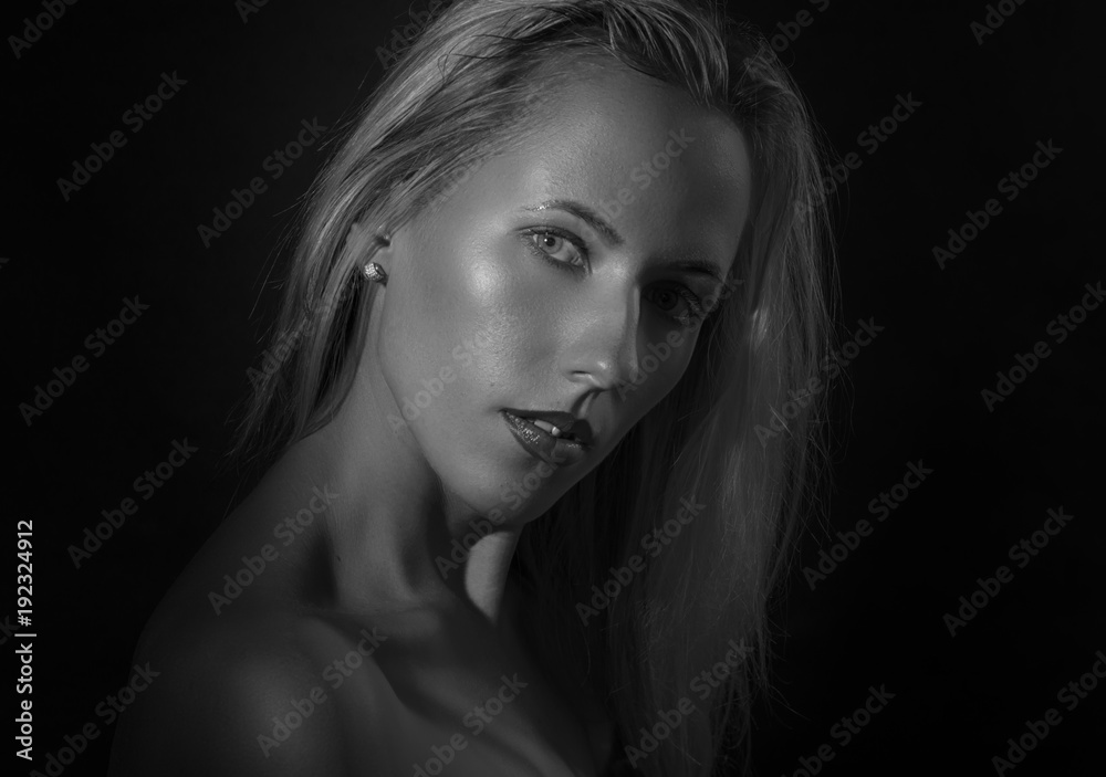 Black and white portrait of a beautiful young woman.