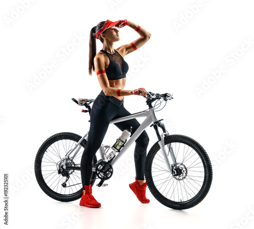 Fototapeta Naklejka Na Ścianę i Meble -  Sporty woman with bike looking into the distance in silhouette on white background. Sport and healthy lifestyle