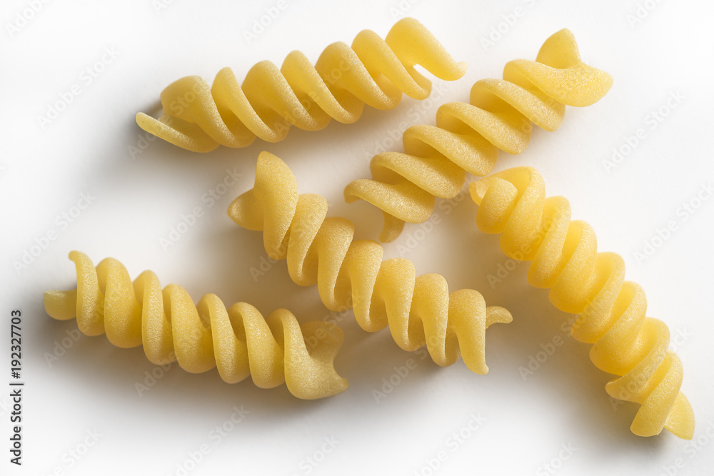 Five pieces of Fusilli pasta isolated on white background Five pieces of Fusilli pasta isolated on white background