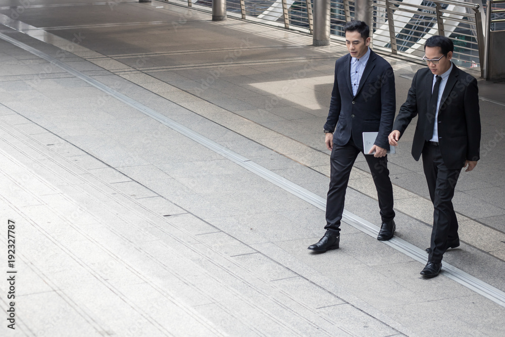 two business talking with partner about business and invetment and step up on stair to office. two business talking with partner about business and invetment and step up on stair to office.