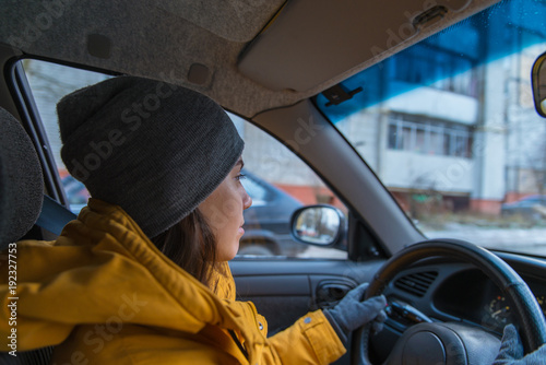 woman drive car in cold winter weather
