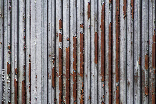 A rusty and weathered looking piece of corrugated metal, texture for background