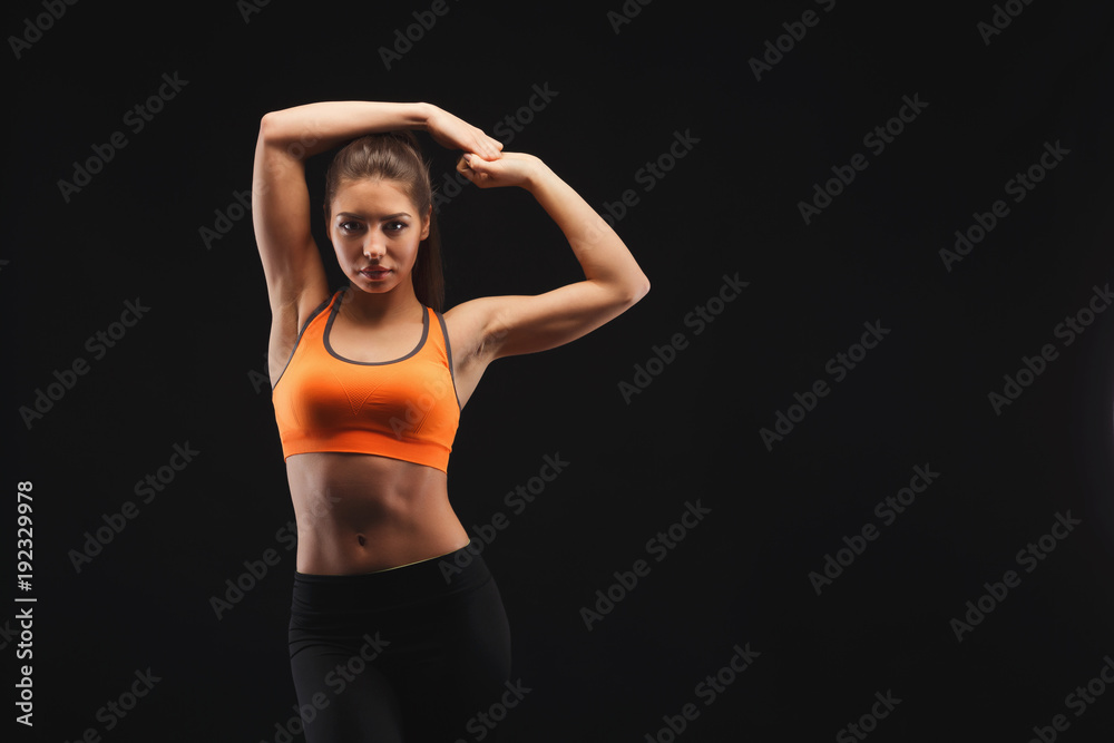 Athletic woman on black background Athletic woman on black background
