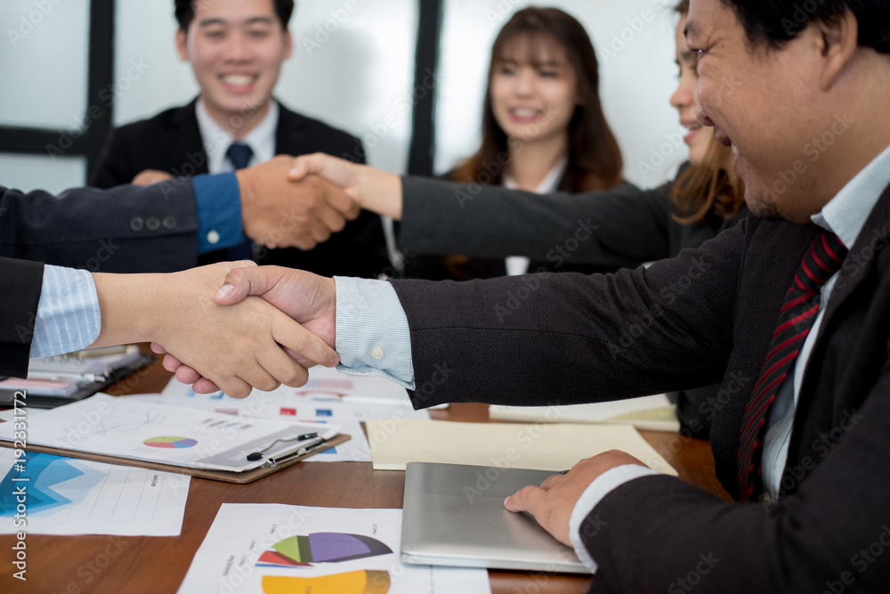Business people shaking hands after finishing up meeting. co worker colleagues handshaking after conference. teamwork, partnership, collaboration, corporate concept. Business people shaking hands after finishing up meeting. co worker colleagues handshaking after conference. teamwork, partnership, collaboration, corporate concept.