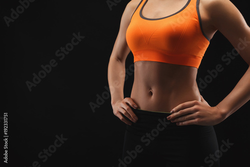 Athletic woman showing muscular body © Prostock-studio