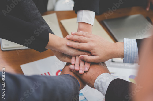 businessman joining hand, business team touching hands together - unity, harmony, teamwork, partnership, collaboration, corporate concept.
