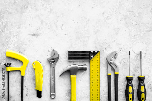 Various repair tools. Must-have for men. Equipment for building. Repair tool kit. Grey background top view pattern copy space