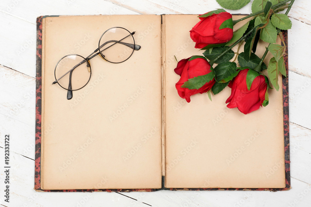 concept romantic, old notebook, roses and glasses concept romantic, old notebook, roses and glasses