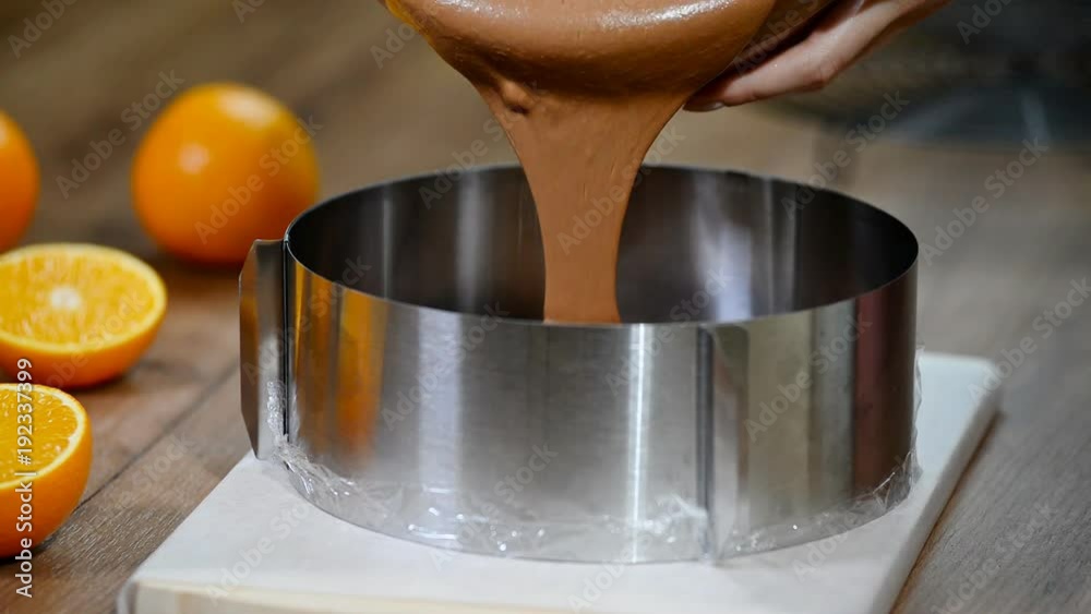 Cooking chocolate mousse cake. Pouring chocolate mousse in the form. Cooking chocolate mousse cake. Pouring chocolate mousse in the form.