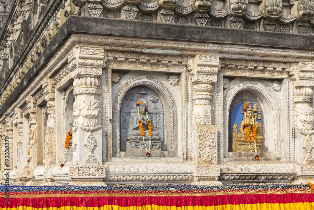 architectural detail with Buddha sculptures at the Mahabodhi Temple, Bodhgaya, Bihar, India