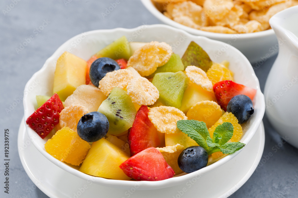 bowl of fresh fruit salad with corn flakes, closeup bowl of fresh fruit salad with corn flakes, closeup