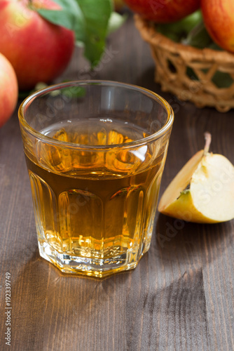 autumn drink - apple cider or juice in a glass, vertical