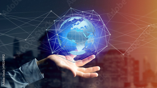 Fototapeta Naklejka Na Ścianę i Meble -  Businessman holding a Connected network over a earth globe concept on a futuristic interface - 3d rendering