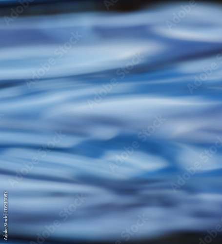 an abstract blue motion background - water level © Vera Kuttelvaserova