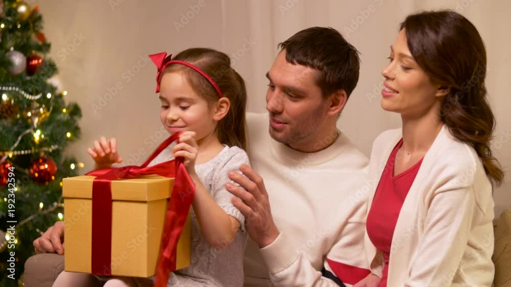 happy family with christmas present at home happy family with christmas present at home