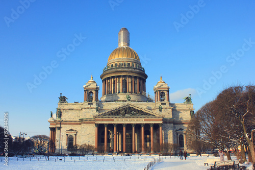 Winter View of Saint Isaac's Cathedral in St. Petersburg, Russia. Main Landmark and Famous City Symbol on Cold Snowy Sunny Day Nature. Outdoor Scene with Blue Sky Background and No People Around.