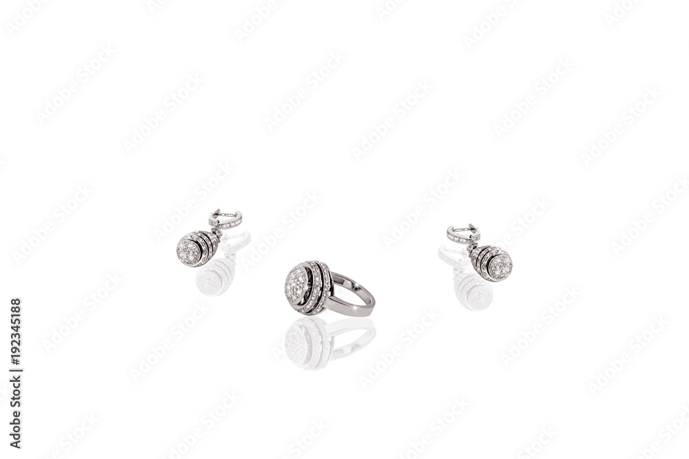 Silver precious ring earrings with diamonds on white isolated background. Silver precious ring earrings with diamonds on white isolated background.
