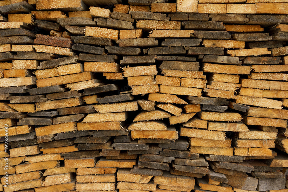 Woodpile. Thin boards stacked on top of each other. Woodpile. Thin boards stacked on top of each other.