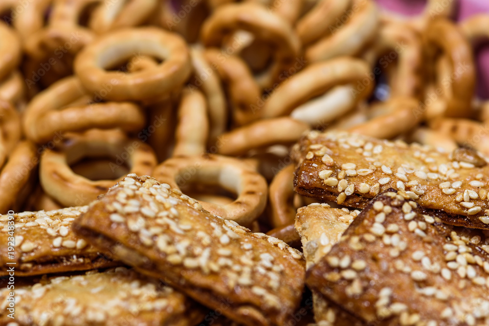biscuits with sesame seeds and small bagels photographed macro