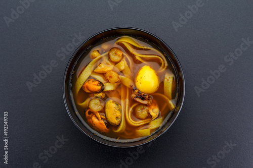 Asian soup over dark background. photo