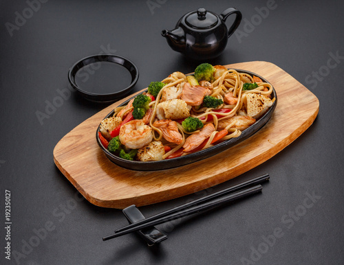 Udon noodels over dark background. photo